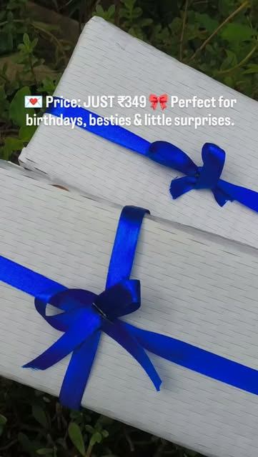 White gift boxes tied with blue satin ribbon
