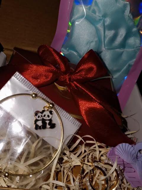 GreenAura pampering hamper with a charm bracelet in crinkle paper