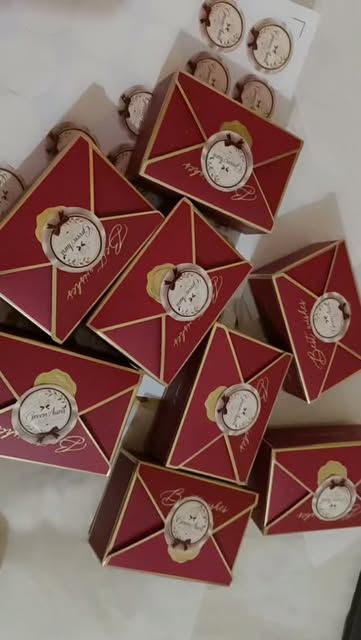 Wine-red envelope gift boxes with gold seals